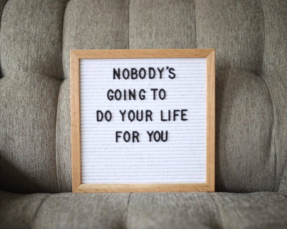 Whiteboard with the phrase Nobody's Going to do Your Life for You