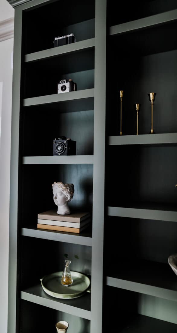 dark built-in shelves with various decorations