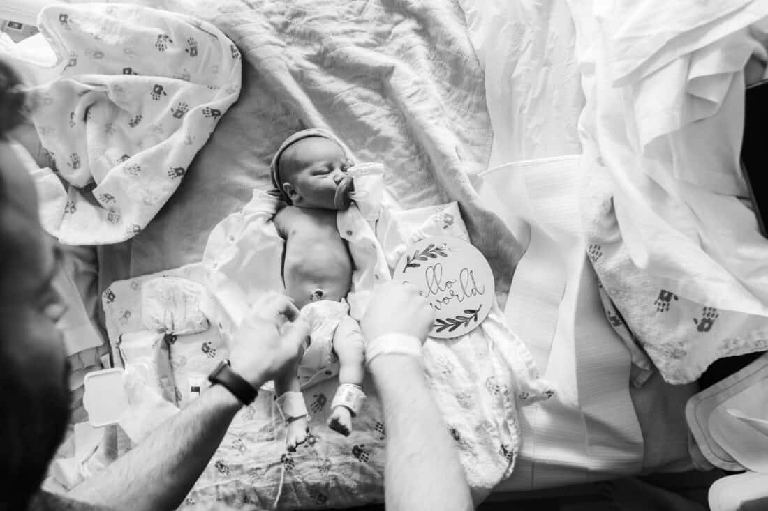 a newborn baby having his diaper changed