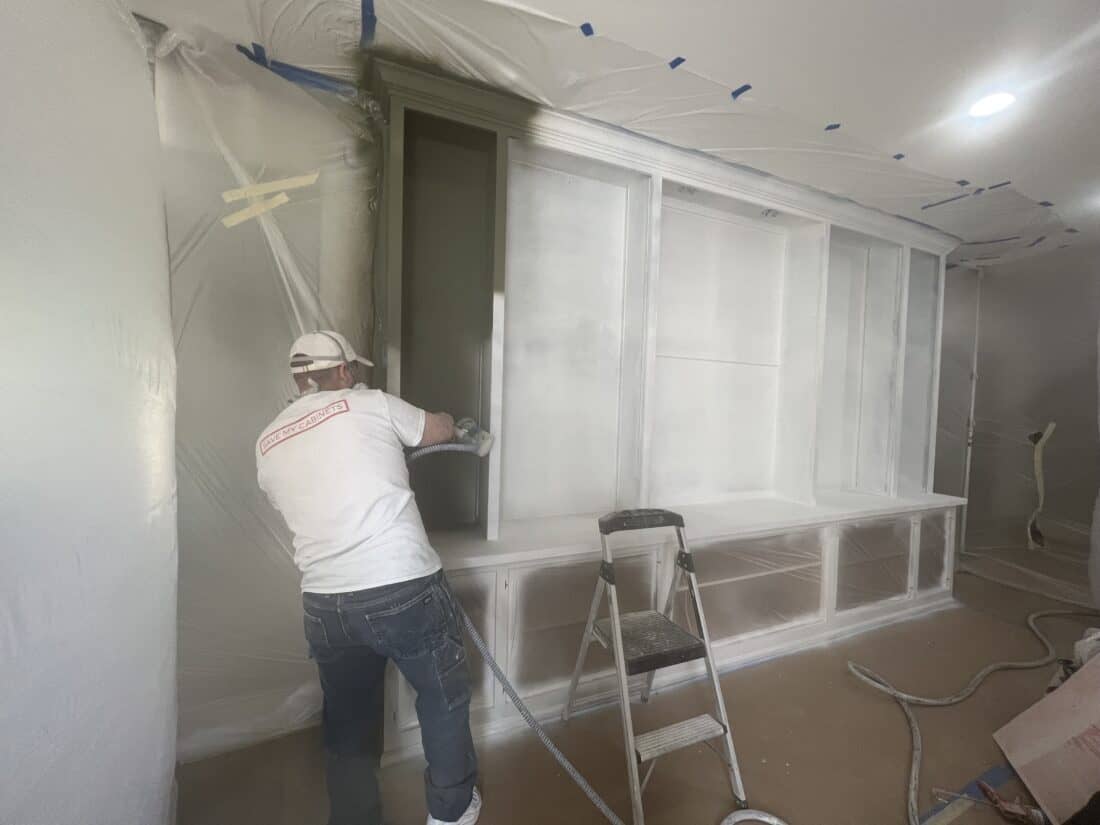 built-in cabinets being painted white