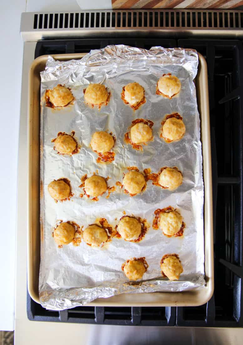 whole30 chicken meatballs arranged on a baking sheet to store for later