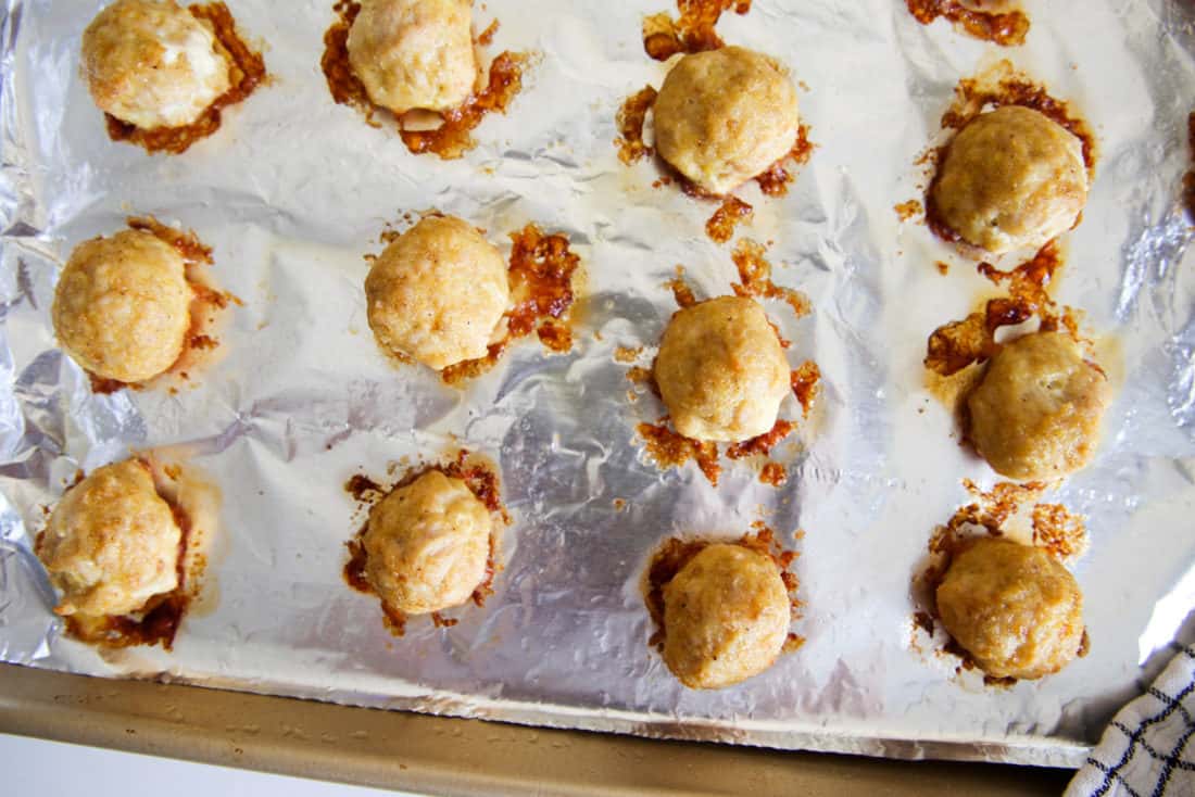 chicken meatballs on a baking sheet 