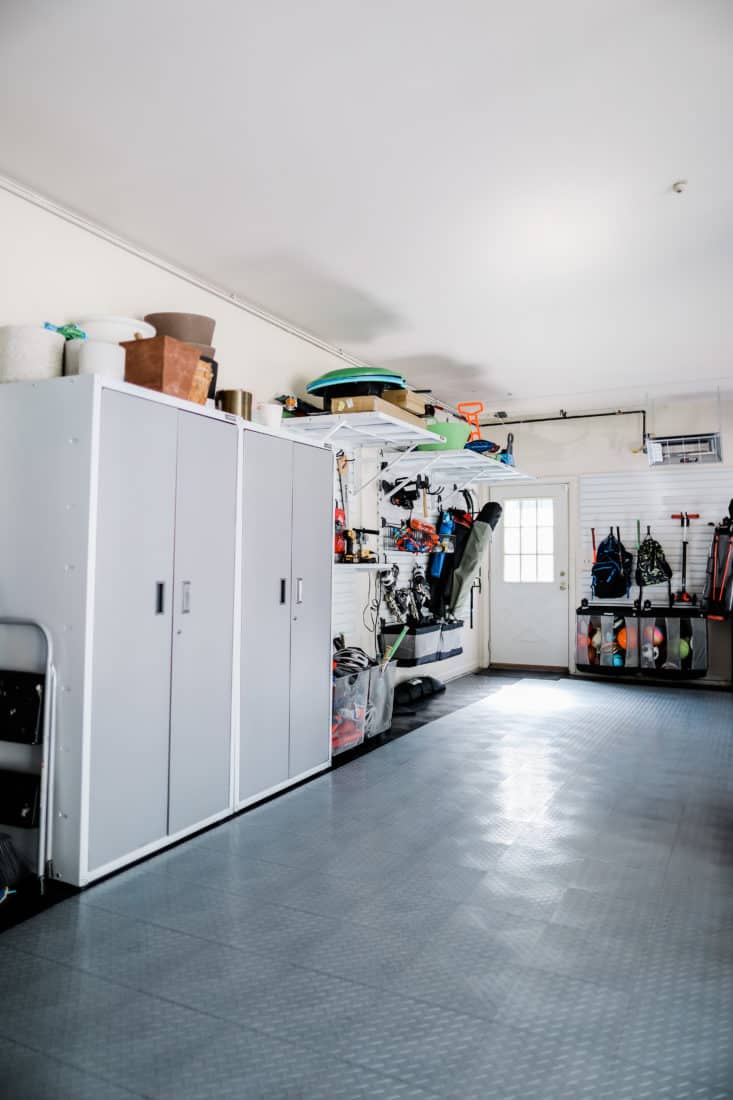 cabinets and storage bins in a garage