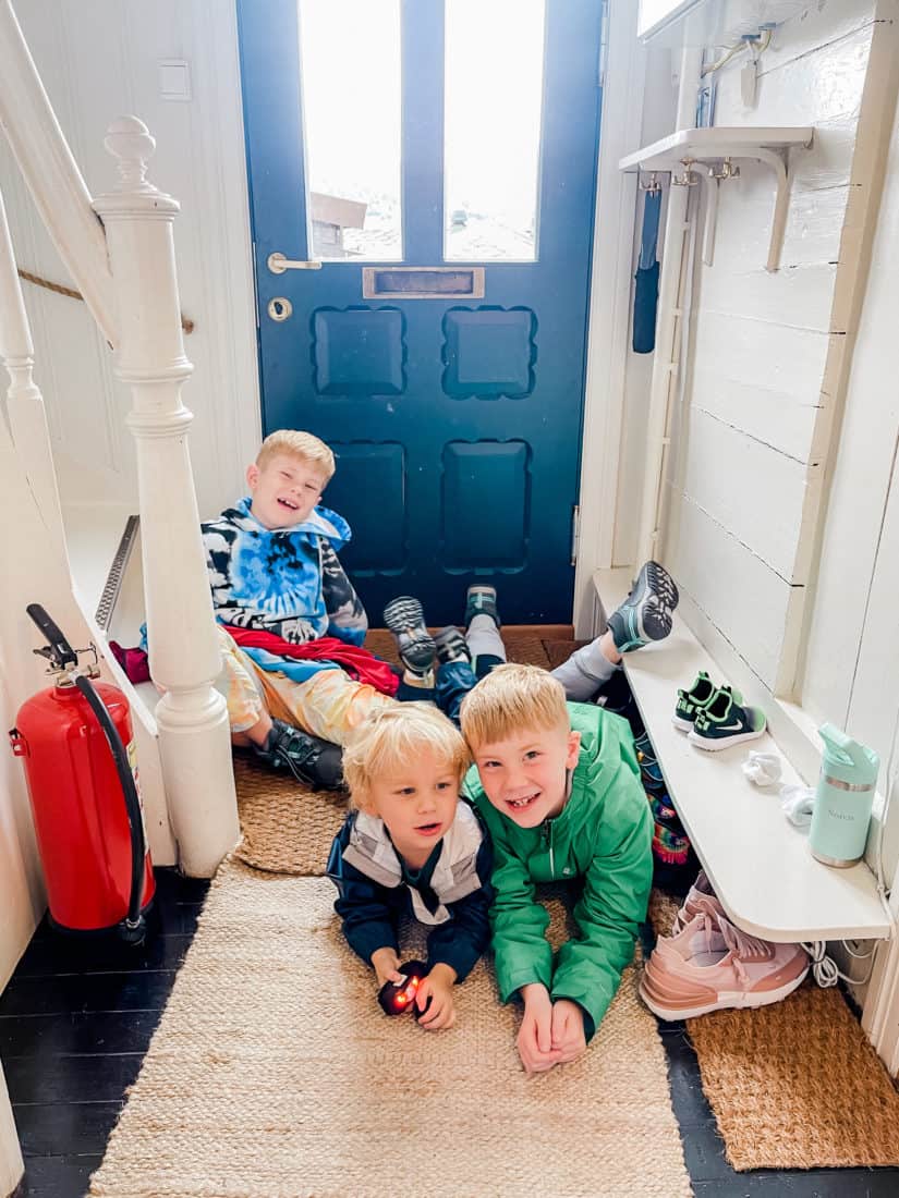 boys playing in a mudroom 
