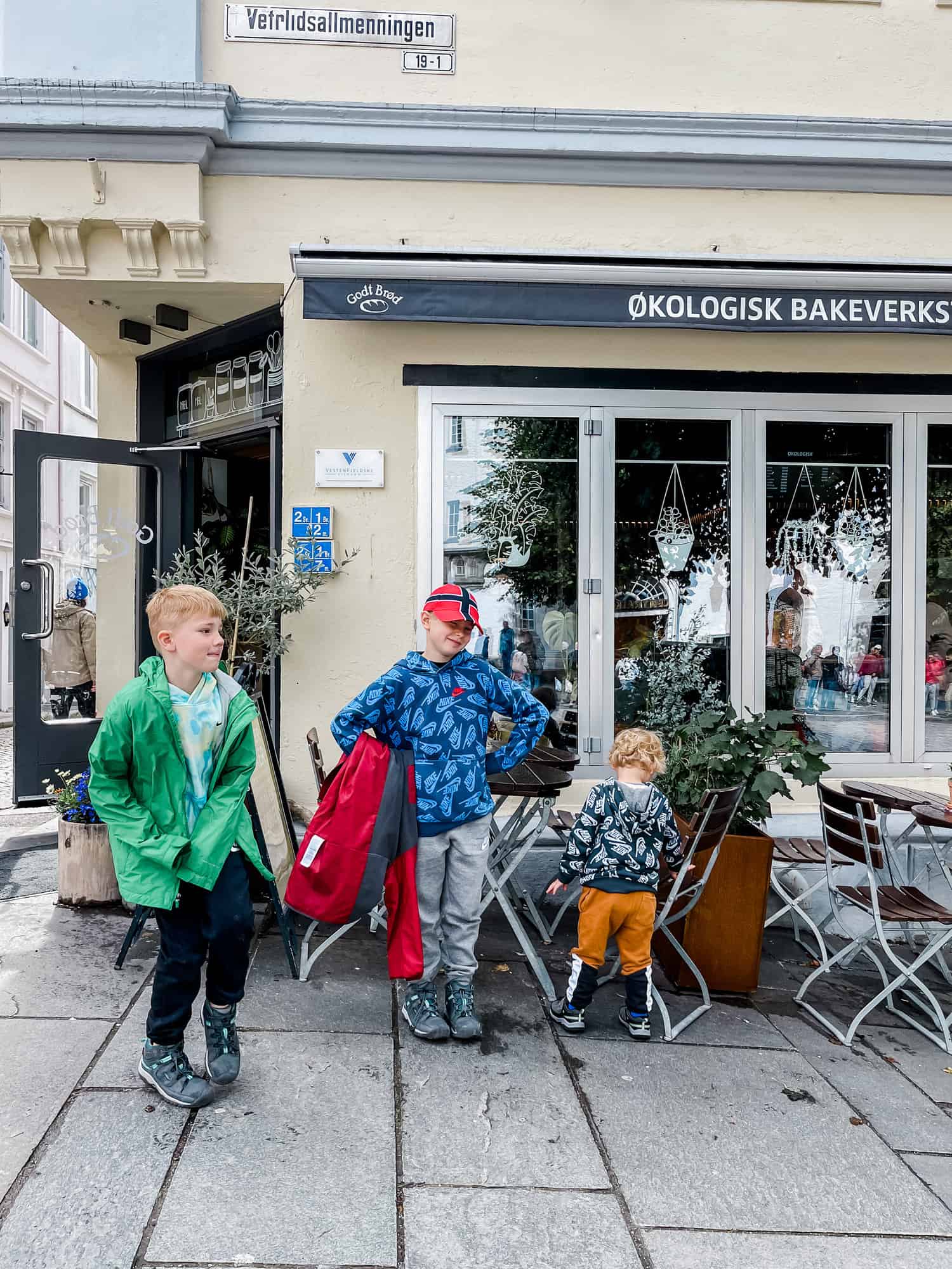 three boys in front of a shop in Norway