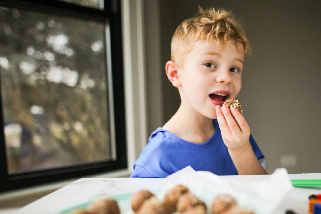 child eating healthy snack