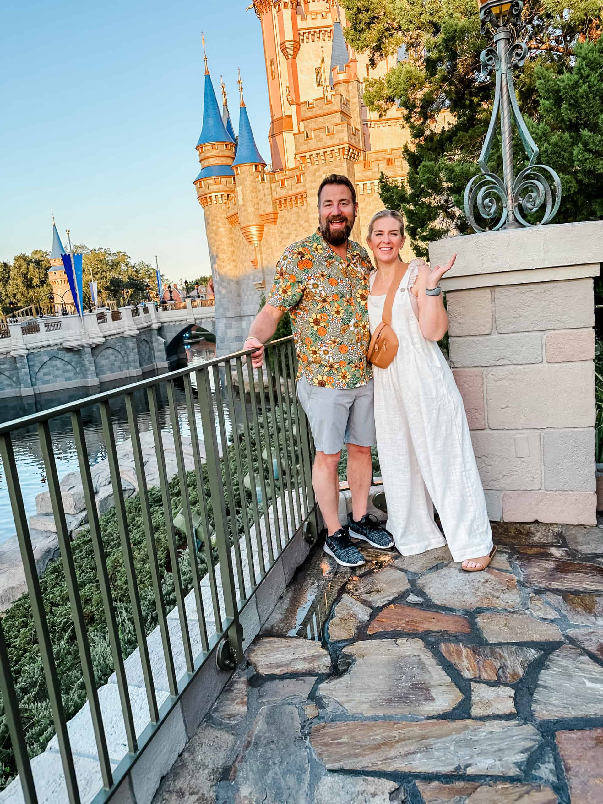 karin and Roger standing by disney castle