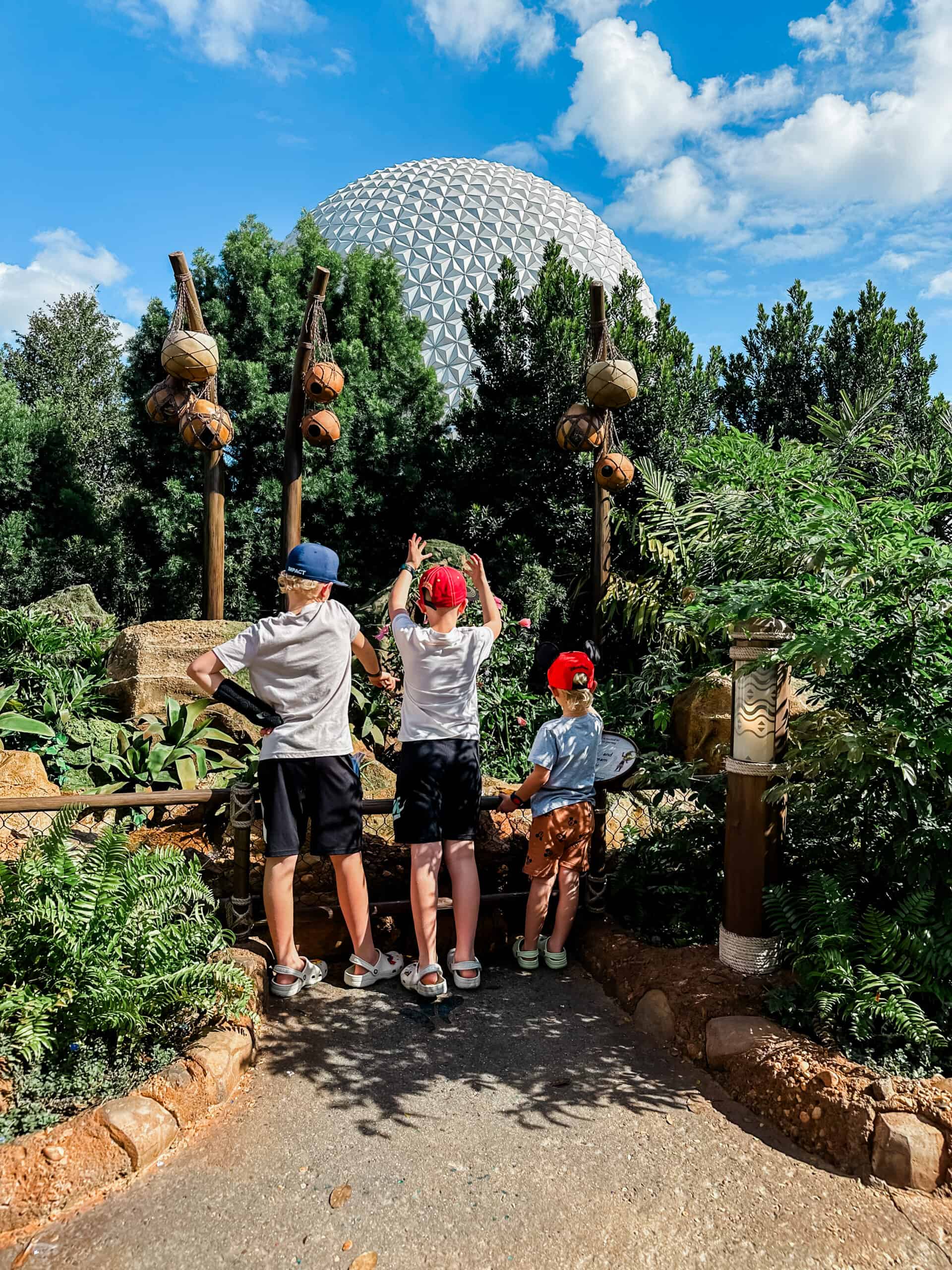 3 boys playing at Epcot